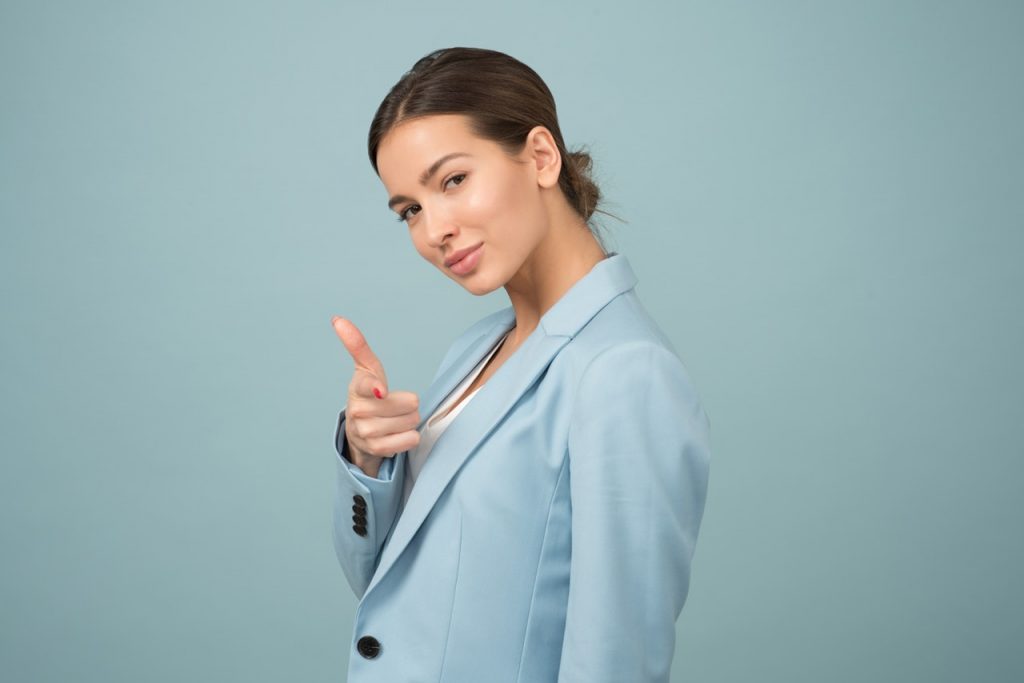 Woman wearing blue shawl lapel suit jacket