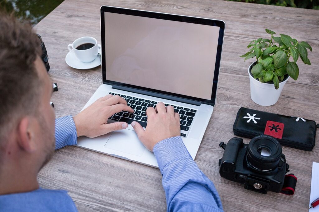 Man working at a desk in his garden